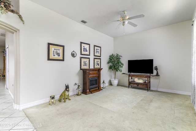 386 Valencia Rd, Melbourne, FL 32904 - living area featuring a ceiling fan, a fireplace, and carpet flooring