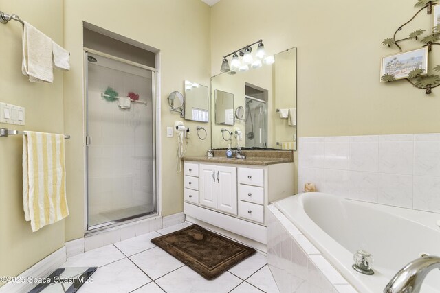386 Valencia Rd, Melbourne, FL 32904 - bathroom with vanity, a bath, a shower stall, and tile patterned flooring