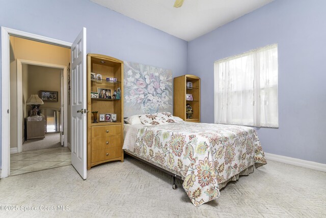 386 Valencia Rd, Melbourne, FL 32904 - carpeted bedroom with baseboards and a ceiling fan