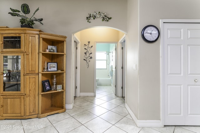 386 Valencia Rd, Melbourne, FL 32904 - corridor featuring arched walkways and light tile patterned floors