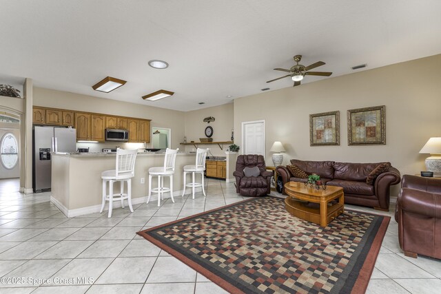 386 Valencia Rd, Melbourne, FL 32904 - living room featuring light tile patterned flooring and ceiling fan