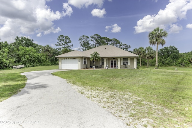 386 Valencia Rd, Melbourne, FL 32904 - view of front facade featuring driveway, a garage, a front yard, stucco siding, and covered porch