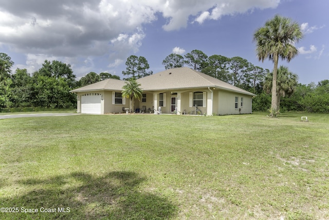386 Valencia Rd, Melbourne, FL 32904 - ranch-style house with an attached garage, a front lawn, driveway, and stucco siding