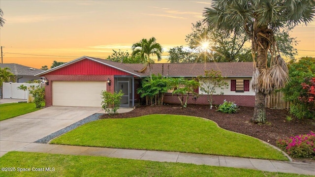 1527 Spruce Rd, Melbourne, FL 32935 - ranch-style house with brick siding, an attached garage, concrete driveway, and roof with shingles