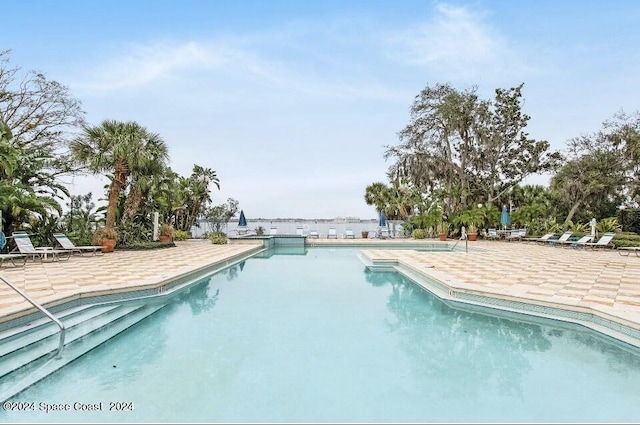 225 S Tropical Trl Unit 607, Merritt Island, FL 32952 - community pool with a patio area