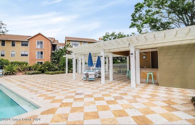 225 S Tropical Trl Unit 607, Merritt Island, FL 32952 - swimming pool featuring a pergola and a patio