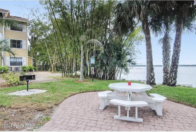 225 S Tropical Trl Unit 607, Merritt Island, FL 32952 - view of patio with a water view