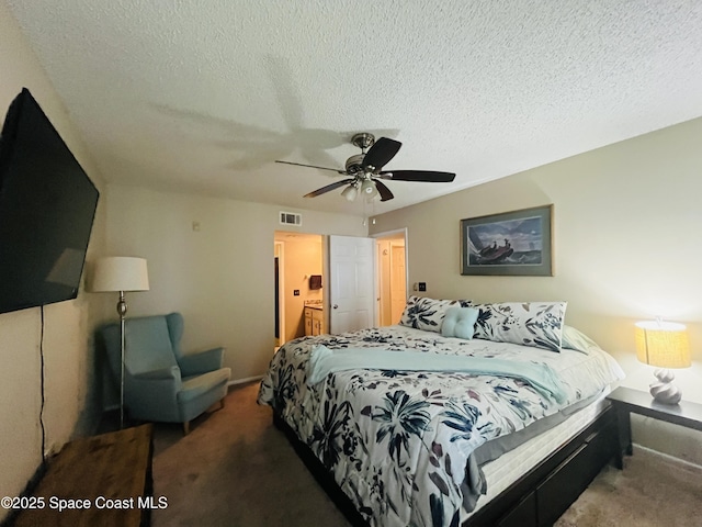 225 S Tropical Trl Unit 607, Merritt Island, FL 32952 - carpeted bedroom featuring a textured ceiling, ceiling fan, and baseboards