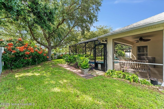 1211 Olde Bailey Ln, Melbourne, FL 32904 - view of green lawn featuring a ceiling fan, an outdoor pool, and a lanai