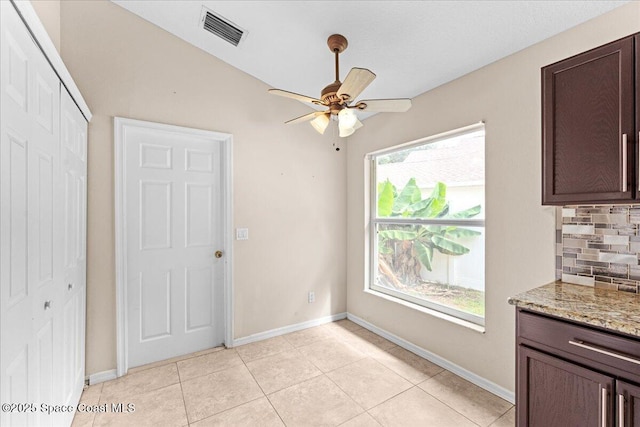 1211 Olde Bailey Ln, Melbourne, FL 32904 - unfurnished dining area featuring a ceiling fan and light tile patterned flooring