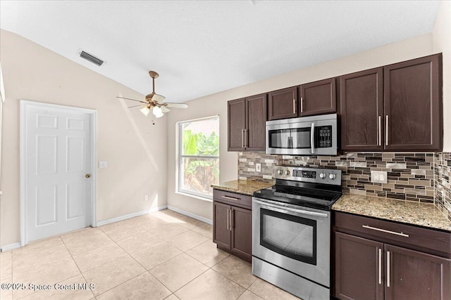 1211 Olde Bailey Ln, Melbourne, FL 32904 - kitchen with stainless steel appliances, decorative backsplash, dark brown cabinets, a ceiling fan, and vaulted ceiling