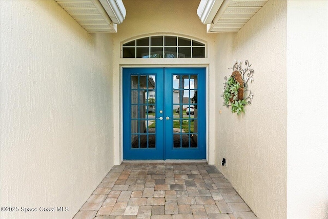 1211 Olde Bailey Ln, Melbourne, FL 32904 - property entrance with french doors and stucco siding