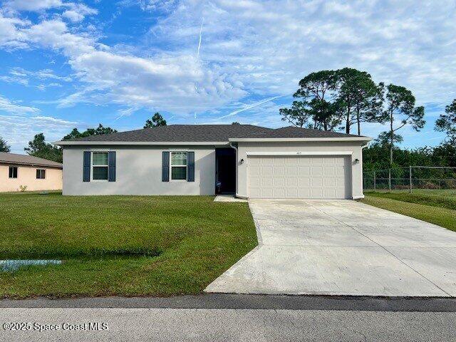 465 Hatcher St SE, Palm Bay, FL 32909 - ranch-style house with stucco siding, a garage, and concrete driveway