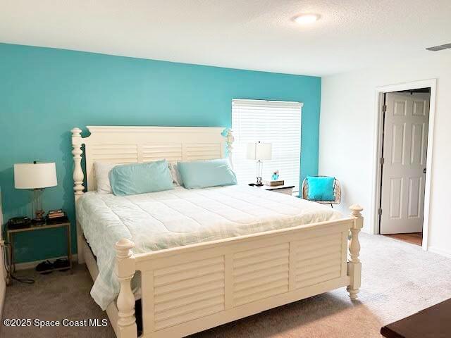 1119 Blossom Dr, Sebastian, FL 32958 - carpeted bedroom featuring baseboards