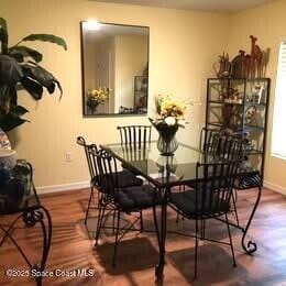 1119 Blossom Dr, Sebastian, FL 32958 - dining area with wood finished floors and baseboards