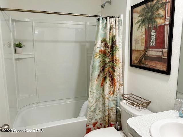 1119 Blossom Dr, Sebastian, FL 32958 - full bath with toilet, shower / bathtub combination with curtain, and vanity