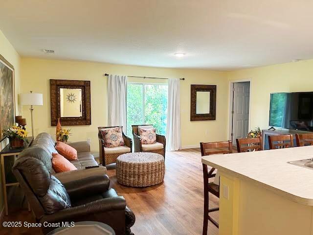1119 Blossom Dr, Sebastian, FL 32958 - living area with light wood finished floors