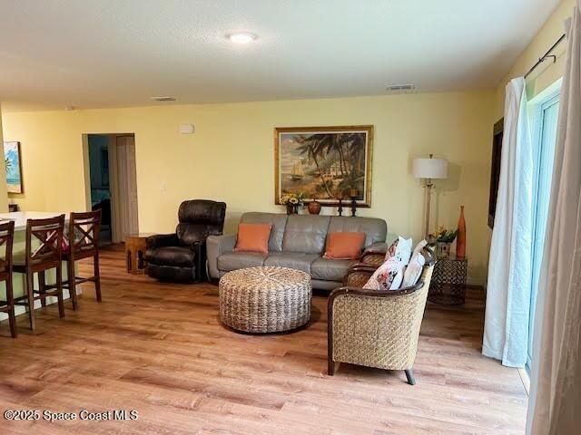 1119 Blossom Dr, Sebastian, FL 32958 - living room featuring light wood-type flooring