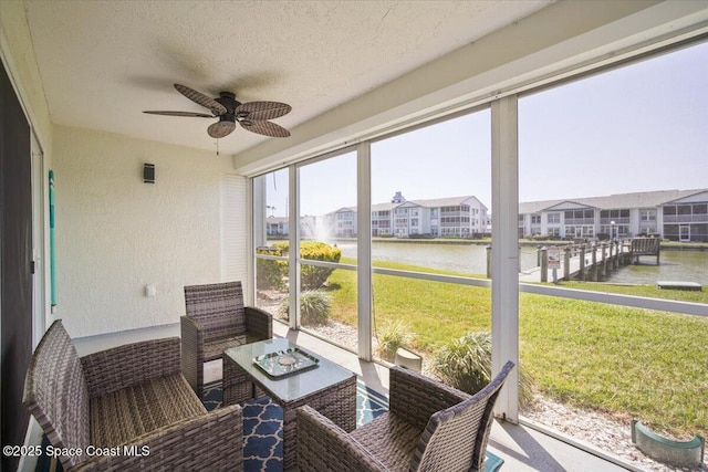 530 S Brevard Ave Unit 315, Cocoa Beach, FL 32931 - sunroom / solarium with a water view, ceiling fan, and a residential view