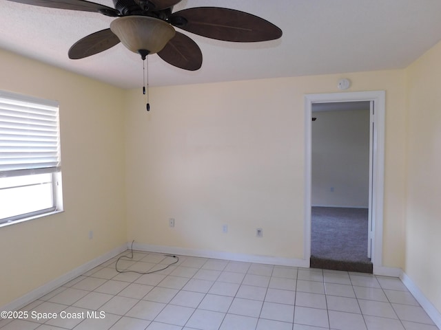 220 Maureen Ave, Merritt Island, FL 32953 - unfurnished room with a smoke detector, a ceiling fan, and light tile patterned floors