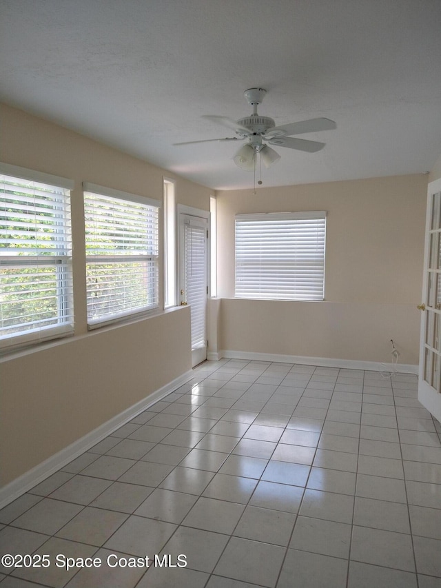 220 Maureen Ave, Merritt Island, FL 32953 - empty room featuring a ceiling fan and light tile patterned floors