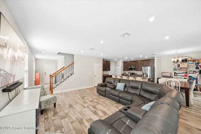848 Brookview Ln, Rockledge, FL 32955 - living area with a chandelier, stairs, light wood finished floors, and recessed lighting