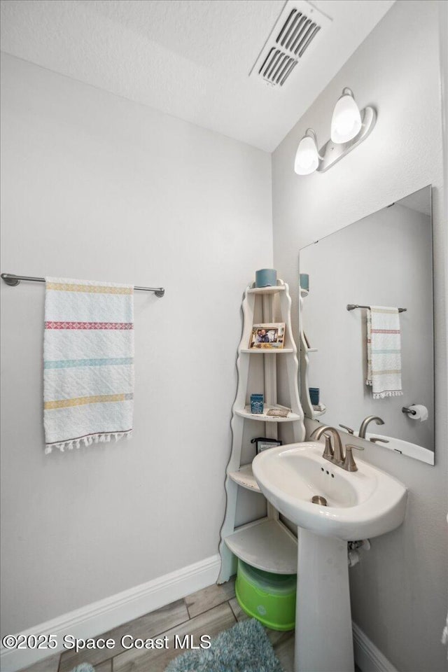 848 Brookview Ln, Rockledge, FL 32955 - bathroom featuring baseboards and a textured ceiling