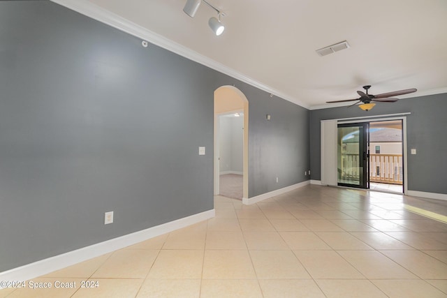 6470 Borasco Dr Unit 3106, Melbourne, FL 32940 - empty room featuring arched walkways, ceiling fan, ornamental molding, light tile patterned floors, and baseboards