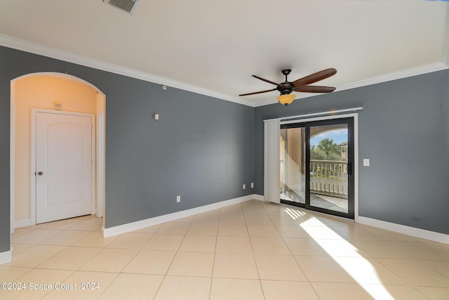 6470 Borasco Dr Unit 3106, Melbourne, FL 32940 - spare room featuring ornamental molding, ceiling fan, arched walkways, baseboards, and light tile patterned flooring