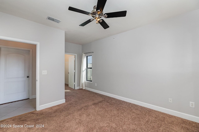6470 Borasco Dr Unit 3106, Melbourne, FL 32940 - unfurnished bedroom with baseboards, light carpet, a ceiling fan, and light tile patterned floors