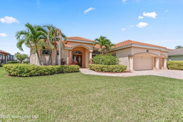 3631 Thurloe Dr, Rockledge, FL 32955 - mediterranean / spanish-style home featuring a front yard, a garage, stucco siding, driveway, and a tile roof