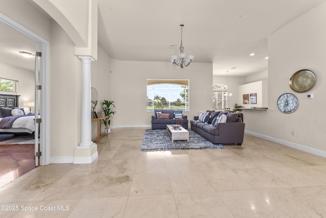 3631 Thurloe Dr, Rockledge, FL 32955 - living room with ornate columns, baseboards, a chandelier, recessed lighting, and arched walkways