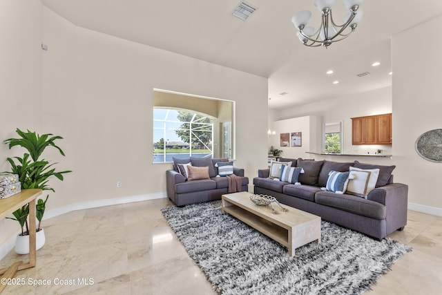 3631 Thurloe Dr, Rockledge, FL 32955 - living area featuring a chandelier, plenty of natural light, recessed lighting, baseboards, and light marble finish floors