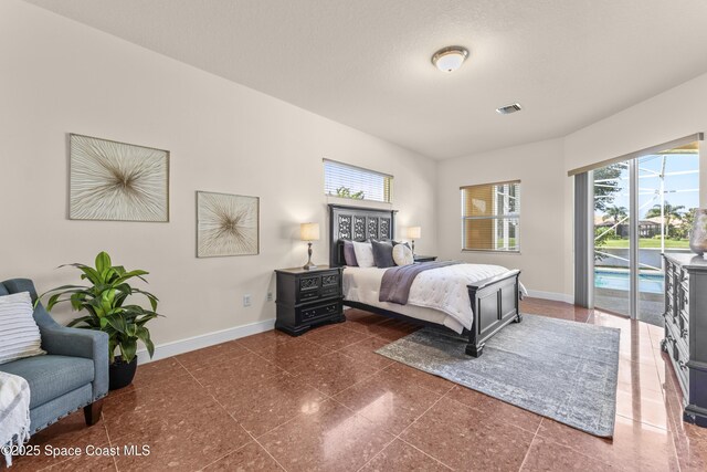 3631 Thurloe Dr, Rockledge, FL 32955 - bedroom featuring baseboards and access to exterior