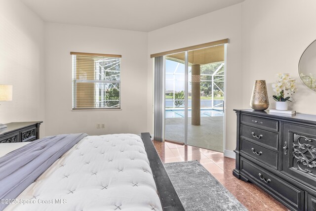 3631 Thurloe Dr, Rockledge, FL 32955 - bedroom featuring access to outside, multiple windows, and light tile patterned flooring