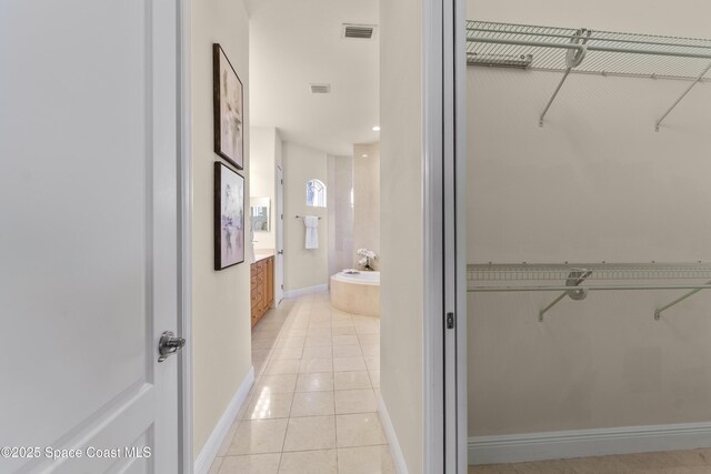 3631 Thurloe Dr, Rockledge, FL 32955 - spacious closet with light tile patterned floors