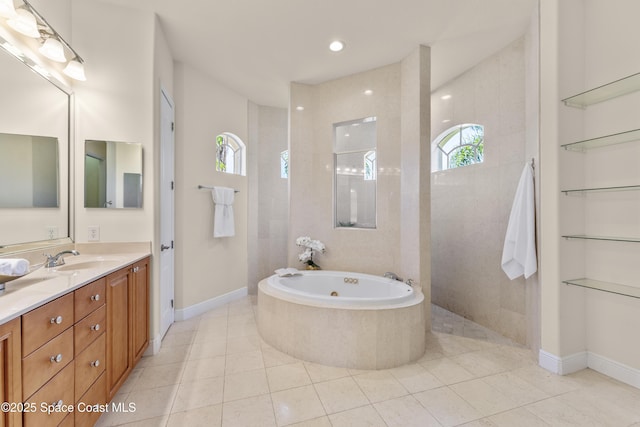 3631 Thurloe Dr, Rockledge, FL 32955 - bathroom with vanity, plenty of natural light, a whirlpool tub, and tile patterned flooring
