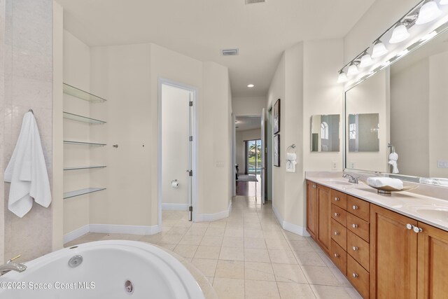3631 Thurloe Dr, Rockledge, FL 32955 - bathroom featuring double vanity, tile patterned flooring, a jetted tub, baseboards, and recessed lighting