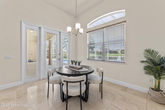 3631 Thurloe Dr, Rockledge, FL 32955 - dining space with a chandelier and baseboards