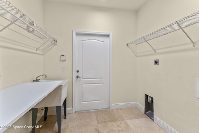 3631 Thurloe Dr, Rockledge, FL 32955 - washroom with electric dryer hookup and baseboards