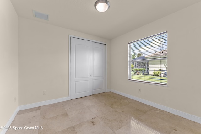 3631 Thurloe Dr, Rockledge, FL 32955 - unfurnished bedroom with a closet and baseboards