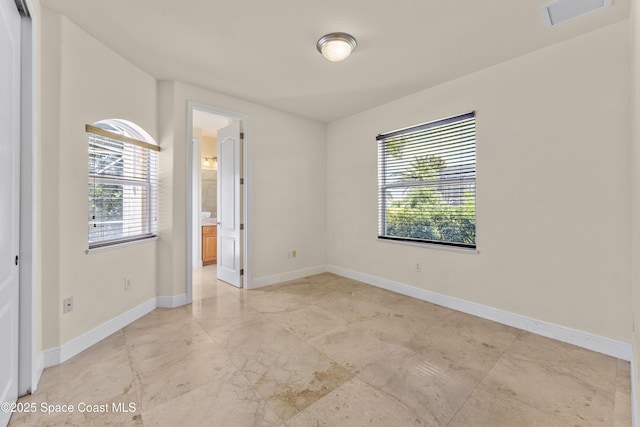 3631 Thurloe Dr, Rockledge, FL 32955 - empty room featuring plenty of natural light and baseboards