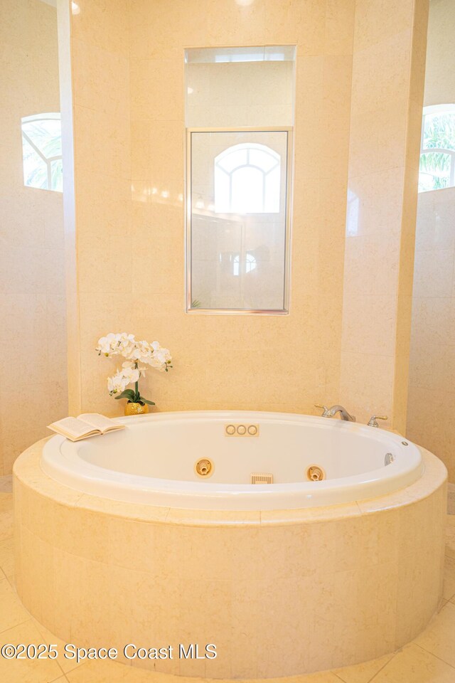 3631 Thurloe Dr, Rockledge, FL 32955 - full bathroom with a tub with jets and tile patterned floors