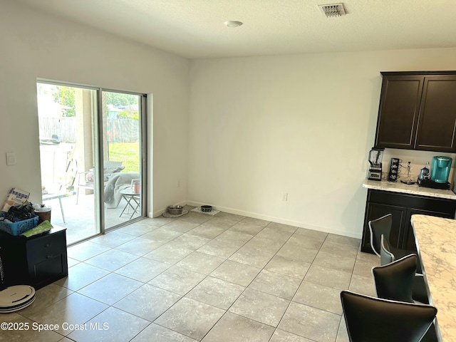 171 Knight St SE, Palm Bay, FL 32909 - dining space featuring light tile patterned floors and a textured ceiling