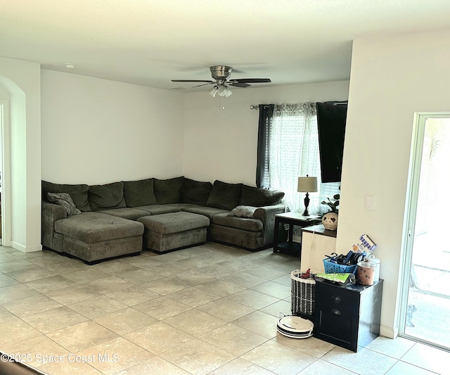 171 Knight St SE, Palm Bay, FL 32909 - living area with arched walkways, ceiling fan, and light tile patterned floors