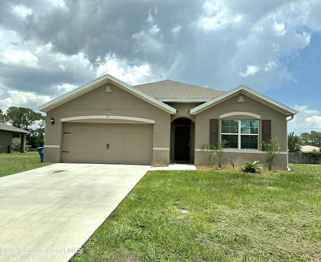 171 Knight St SE, Palm Bay, FL 32909 - ranch-style house featuring stucco siding, a front lawn, concrete driveway, and an attached garage
