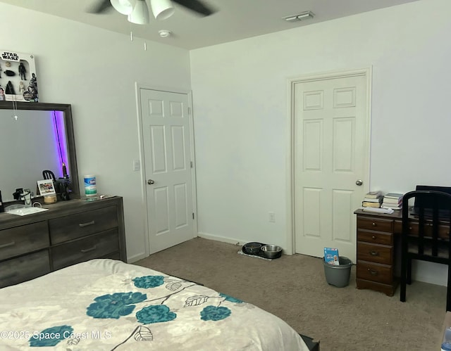 171 Knight St SE, Palm Bay, FL 32909 - carpeted bedroom with ceiling fan and a desk