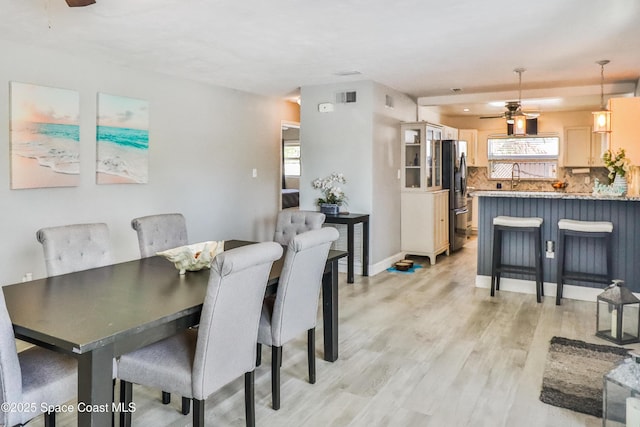 348 Berkeley St, Satellite Beach, FL 32937 - dining space featuring ceiling fan, light wood-style flooring, and healthy amount of natural light