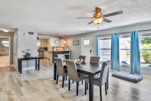 348 Berkeley St, Satellite Beach, FL 32937 - dining area featuring ceiling fan and light wood-type flooring