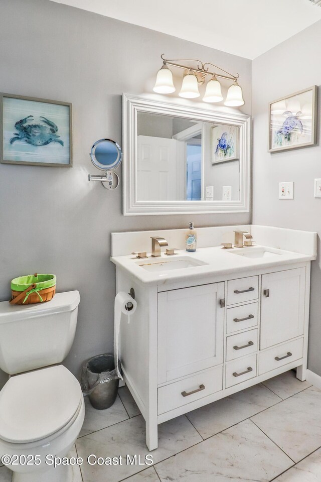 348 Berkeley St, Satellite Beach, FL 32937 - bathroom with toilet and double vanity